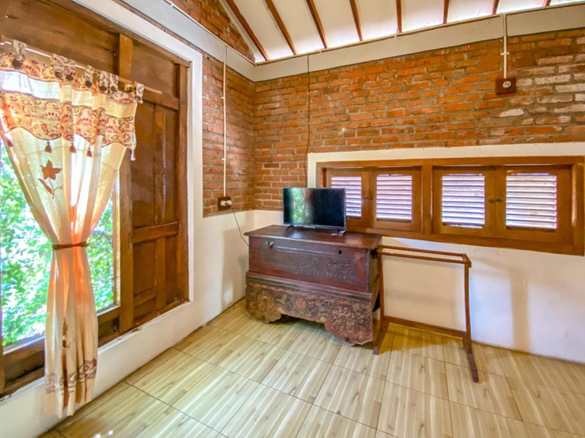 Griya Gribig Guest House Mitra Reddoorz Malang Zewnętrze zdjęcie